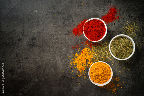 Fototapeta Naklejka Na Ścianę i Meble -  Set of spices on black background.