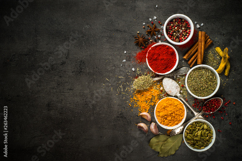 Fototapeta Naklejka Na Ścianę i Meble -  Set of various spices on black background.