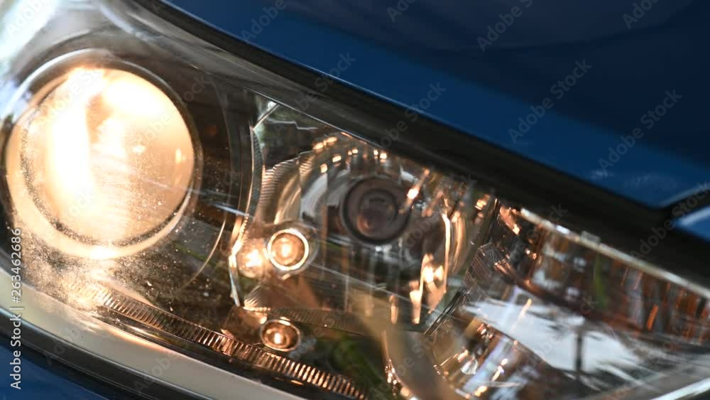 Close up of modern car headlight with low light Close up of modern car headlight with low light