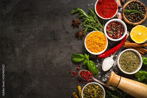 Fototapeta Naklejka Na Ścianę i Meble -  Set of various spices on black background.