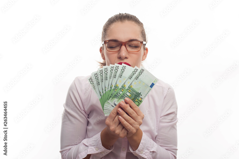 Portrait of young woman holding 100 euro cash fan Portrait of young woman holding 100 euro cash fan