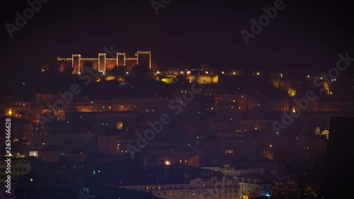 Wallpaper Mural Saint George Moorish castle occupying a hilltop overlooking the center of Lisbon and Tagus River. Night illuminations during Christmas holiday season Torontodigital.ca