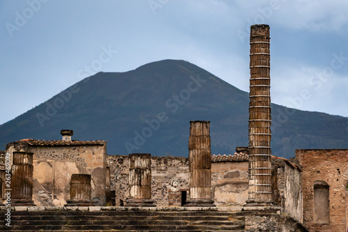 Ruins of the ancient Roman city of Pompeii, which was buried under ash and pumice after the 79 AD volcanic eruption of Mount Vesuvius (background) is now an archaeological site in southern Italy. 