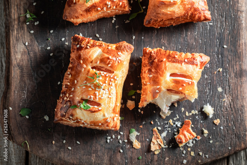 Homemade sausage in puff pastry as a snack for breakfast