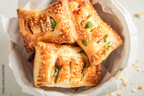 Canvastavla Delicious sausage in puff pastry as a snack for breakfast