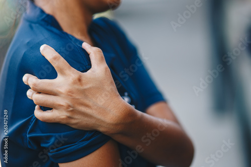 Shoulder Injuries , young woman with pain in shoulder, Ache in human body , office syndrome , health care concept
