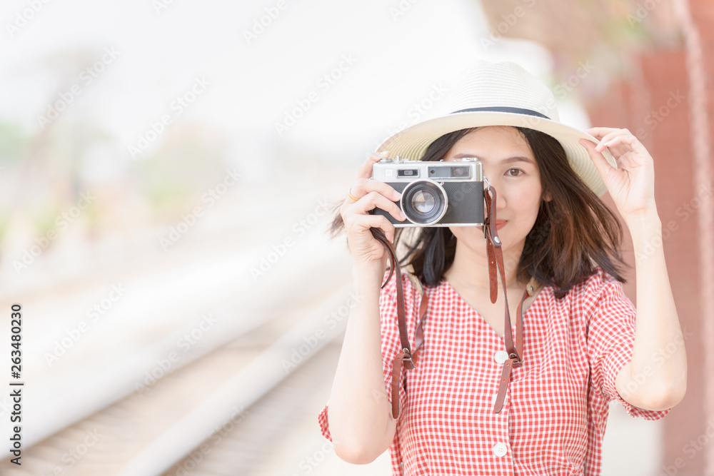 Young Hipster traveler take photo by vintage camera, Travel concept