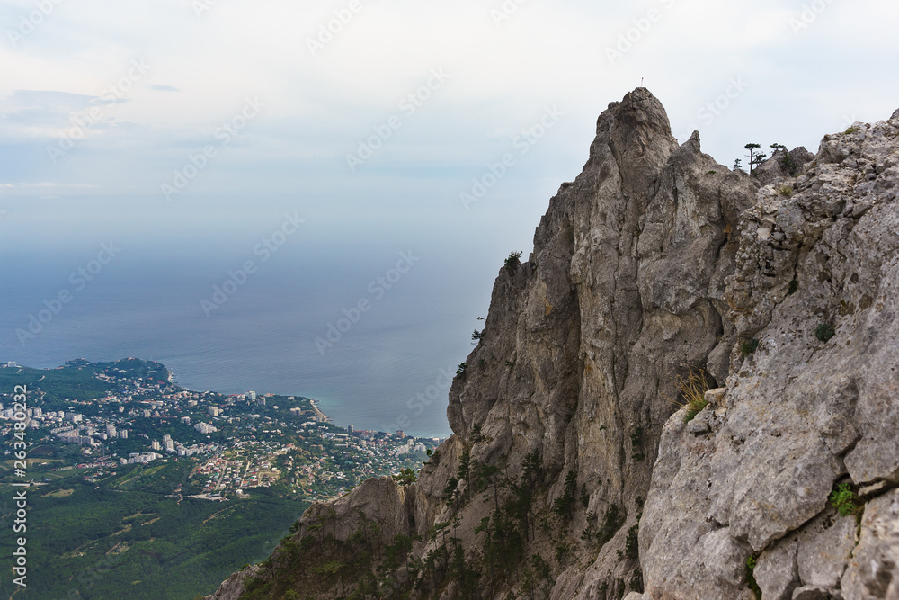 High stone teeth of the AI-Petri mountain with a height of 1234 meters above sea level rises above the Crimean coast