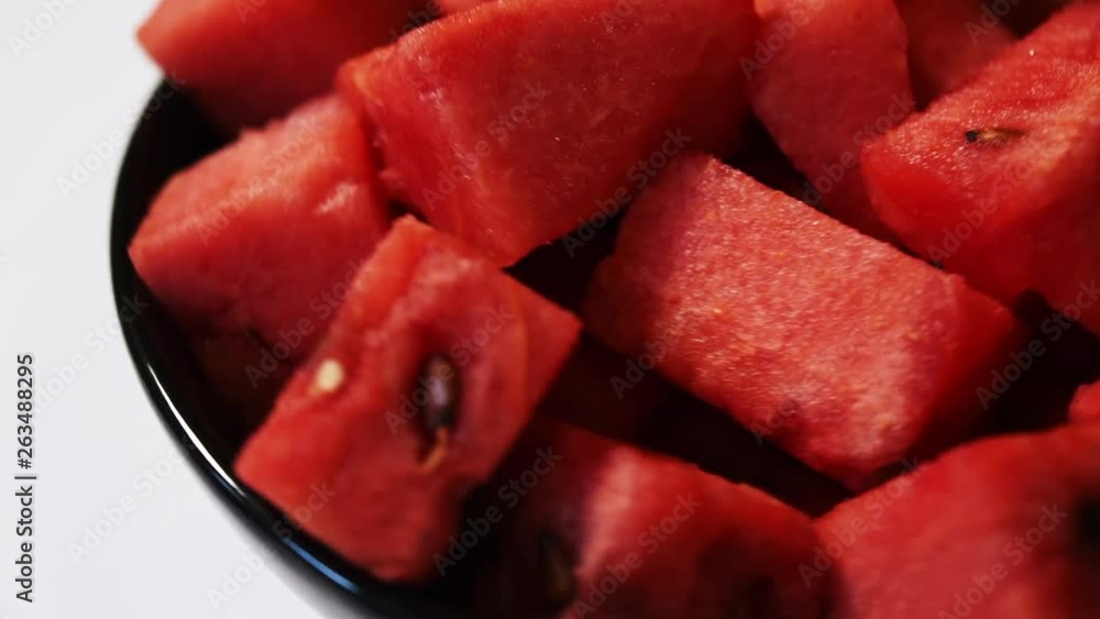 Watermelon / tarbooj fruit cube slices served in a bowl. selective focus Watermelon / tarbooj fruit cube slices served in a bowl. selective focus
