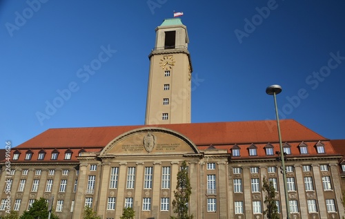 Evening close-up view of the famous Town Hall Spandau (Rathaus Spandau) in beautiful golden light on August 9, 2015, Berlin, Germany photo