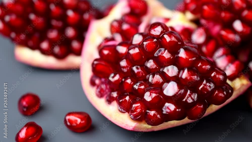 Rotating india pomegranate Seeds on black background in 4K resolution Rotating india pomegranate Seeds on black background in 4K resolution