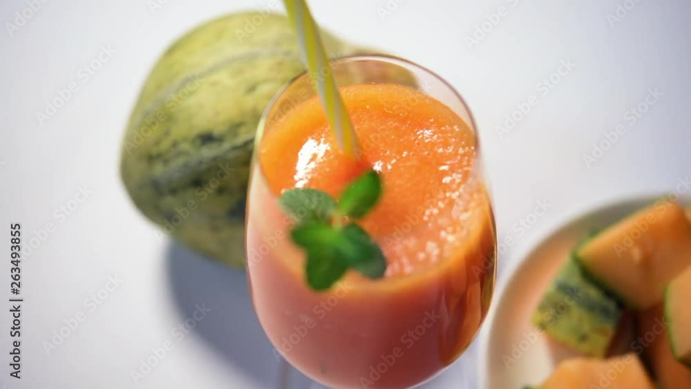 Muskmelon Juice or kharbuj/kharbuja extract in a glass, selective focus Muskmelon Juice or kharbuj/kharbuja extract in a glass, selective focus