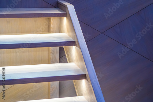 Wooden staircase with light...