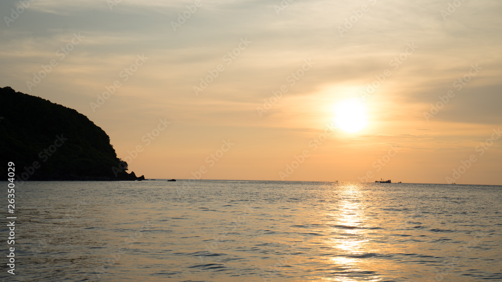 Landscape of beautiful sunset in Phu Quoc island sandy beach with colorful sky and dramatic clouds over wavy sea Landscape of beautiful sunset in Phu Quoc island sandy beach with colorful sky and dramatic clouds over wavy sea