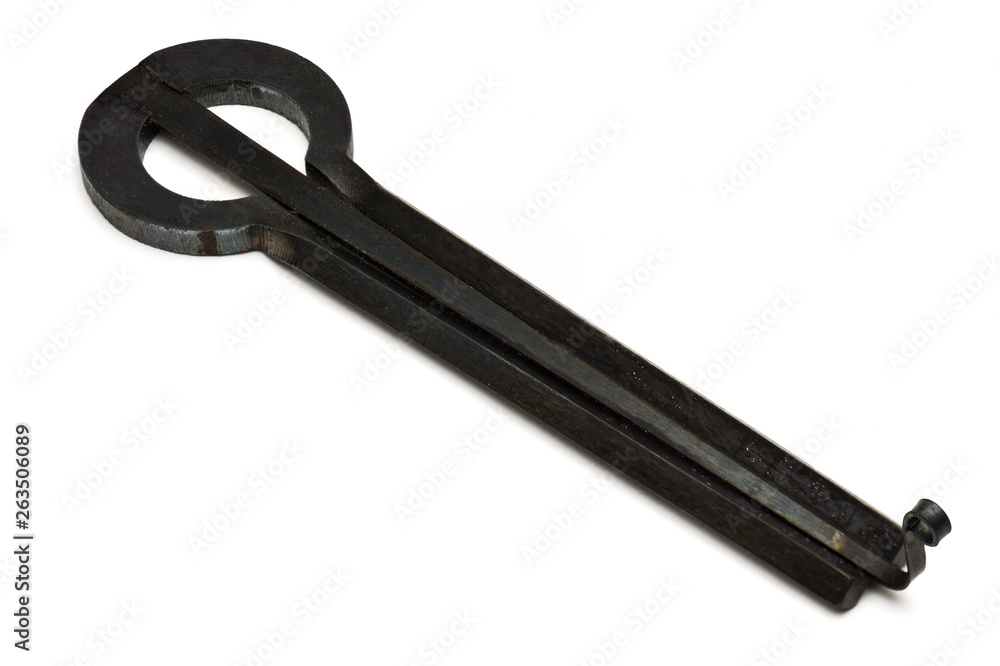 Jew's harp lamellophone handmade instrument with corrosion-resistant coating isolated on white background Jew's harp lamellophone handmade instrument with corrosion-resistant coating isolated on white background