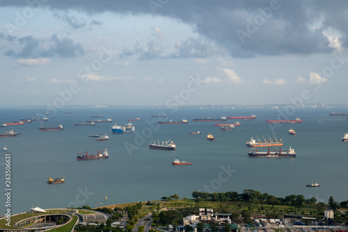 Singapore anchorage area panorama opposite Gardens by the Bay with many ships on an anchorage	