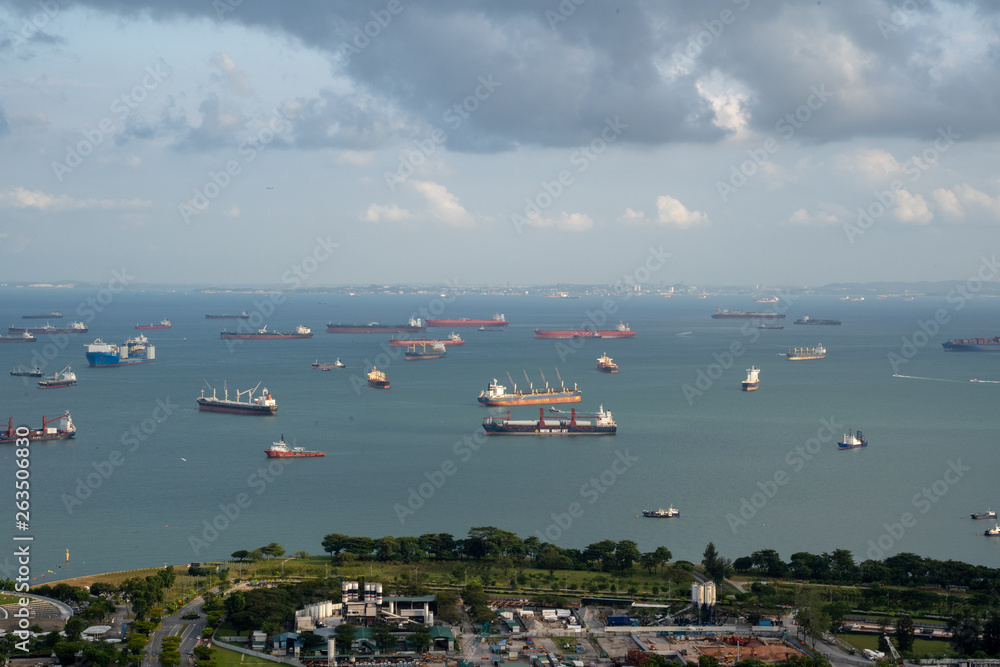 Singapore anchorage area panorama opposite Gardens by the Bay with many ships on an anchorage	