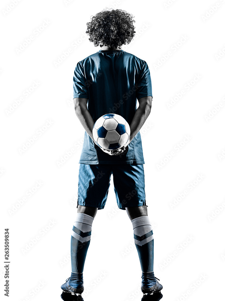 Obraz premium one mixed race young teenager soccer player man playing in silhouette isolated on white background
