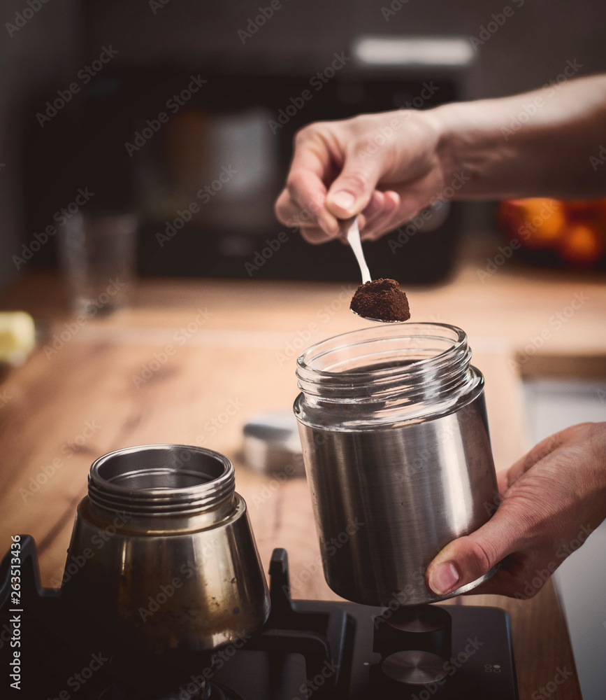 Preparing a traditional italian style coffee with coffee percolator. Making a coffe. Preparing a traditional italian style coffee with coffee percolator. Making a coffe.