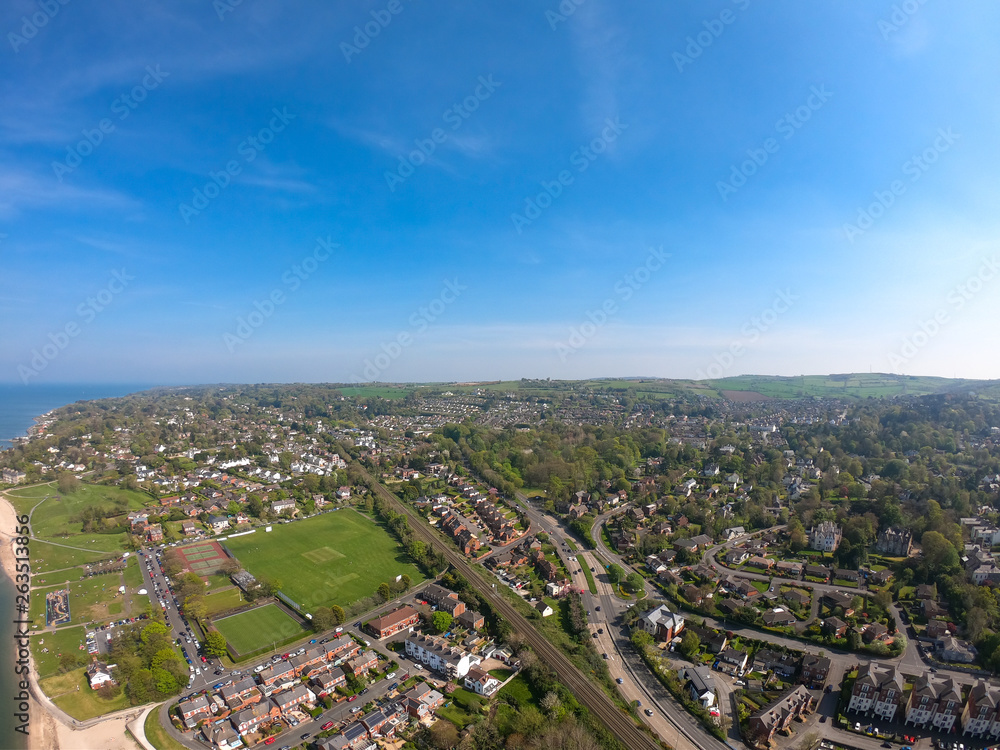 Aerial view on houses near beach on coast of Irish Sea in Holywood Northern Ireland. Countryside view against clear blue sky