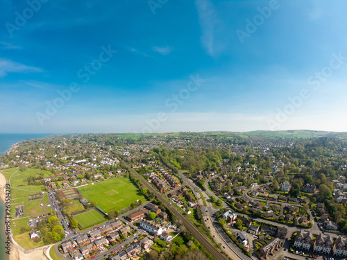 Aerial view on houses near beach on coast of Irish Sea in Holywood Northern Ireland. Countryside view against clear blue sky