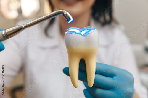 Process of filling on fake tooth
