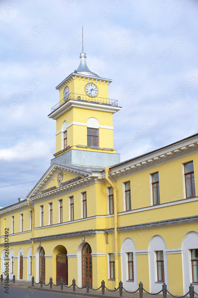 Fototapeta premium City Clock Tower over the yellow house, urban architecture