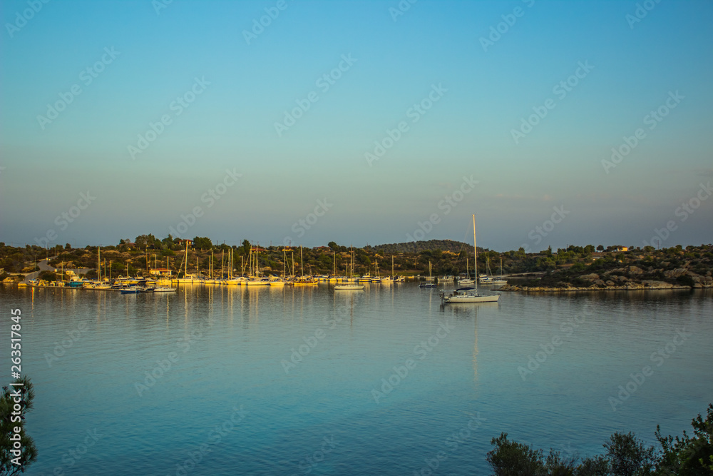 sea bay calming outdoor scenery landscape with yachts on water surface in evening silent natural environment 