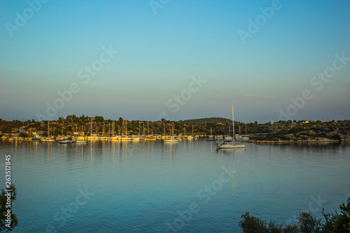 sea bay calming outdoor scenery landscape with yachts on water surface in evening silent natural environment  © Артём Князь