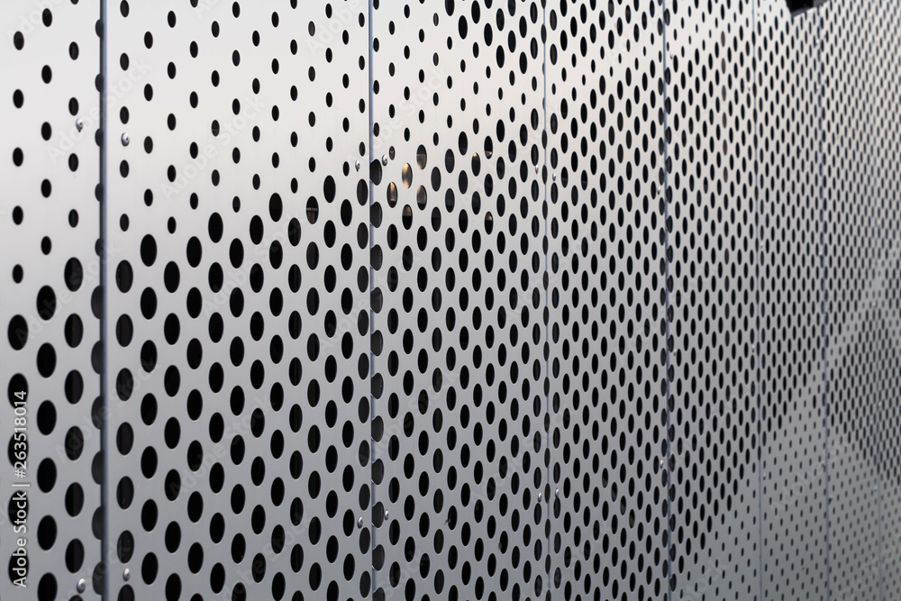 Perforated metal panel. Facing of buildings and structures perforated metal siding. Horizontal. - obrazy, fototapety, plakaty 