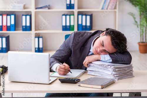 Young male employee working in the office