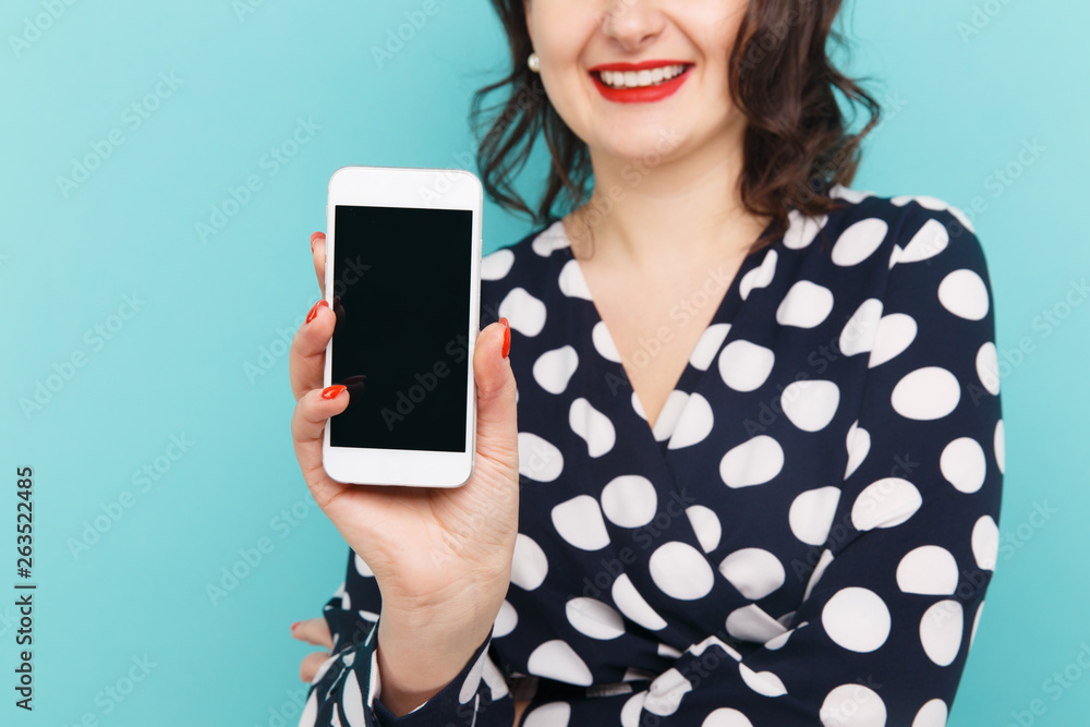 Closeup view of white phone in woman's hand Closeup view of white phone in woman's hand