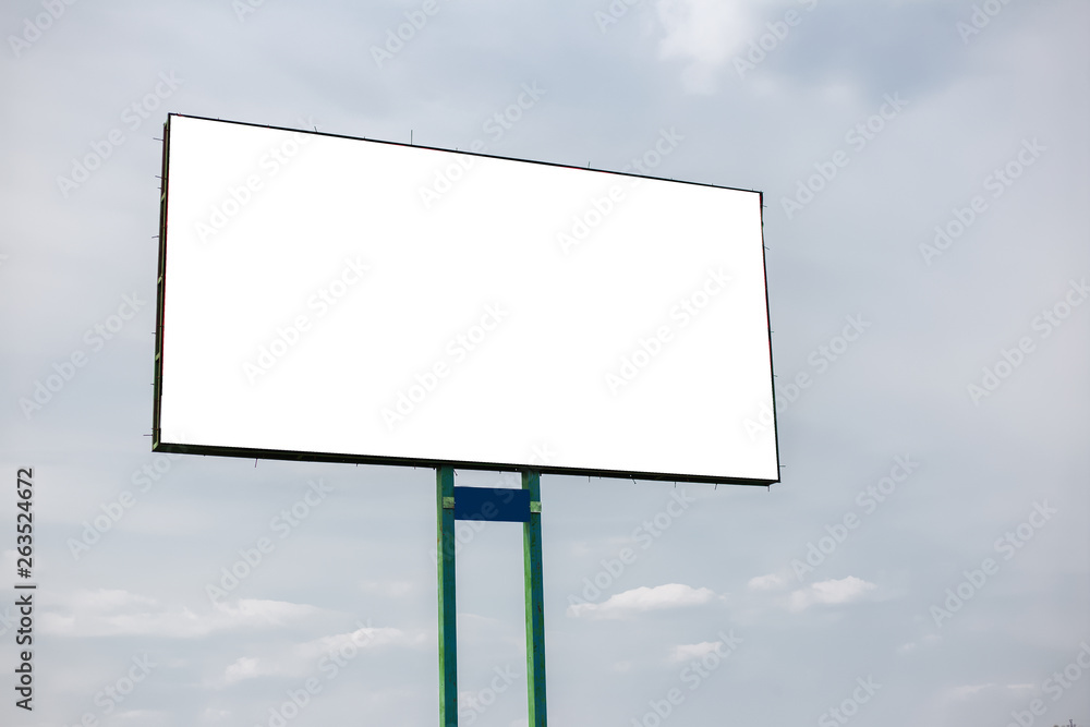 Obraz premium Empty billboard blank for advertising, on background of cloudy sky.