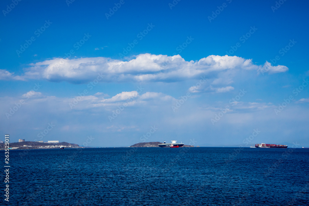 View of Vladivostok and small islands and ships in sunny day with beautiful clouds.