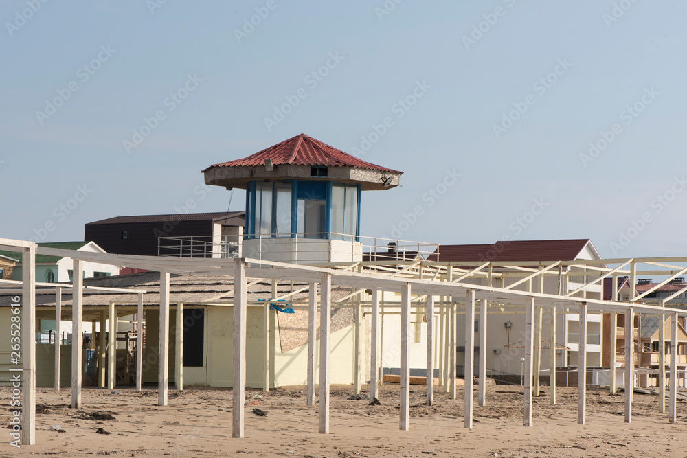Fototapeta premium rescue tower on a sandy beach. the tower was not photographed during the summer season. there are no rescuers on the tower and no people either. near the tower is a place in shizlong. in the