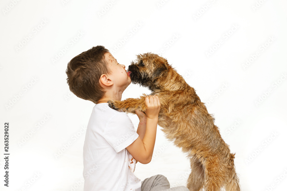 little boy in chocolate with his dog little boy in chocolate with his dog