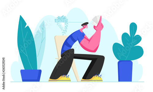 Funny Smiling Man Sitting at Chair with Cards in Hand