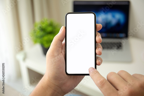man hands holding phone with isolated screen in the room