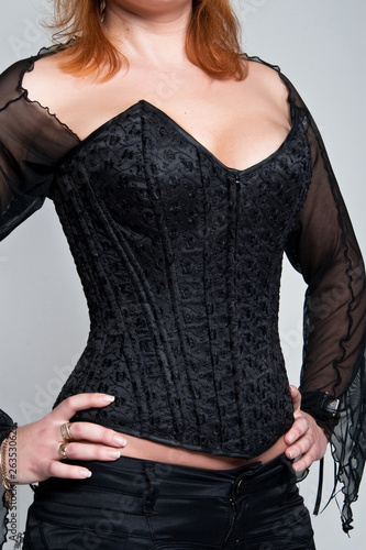 Woman  laced in a corset.