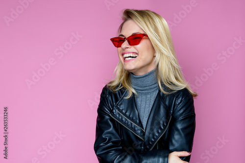 Photo of happy blonde in pink glasses © snedorez