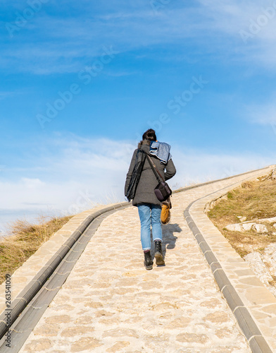 Female Tourist Walking at Thin Walking Trail © 0804Creative