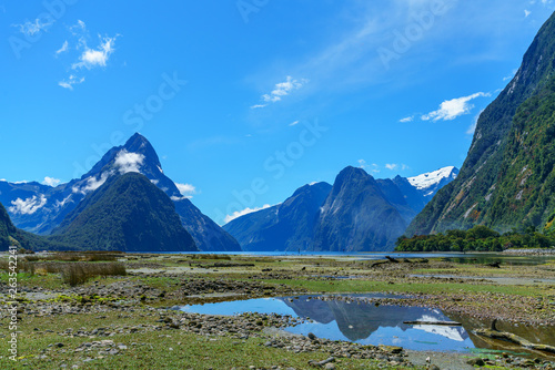 reflections of mountains in the water, milford sound, new zealand 11