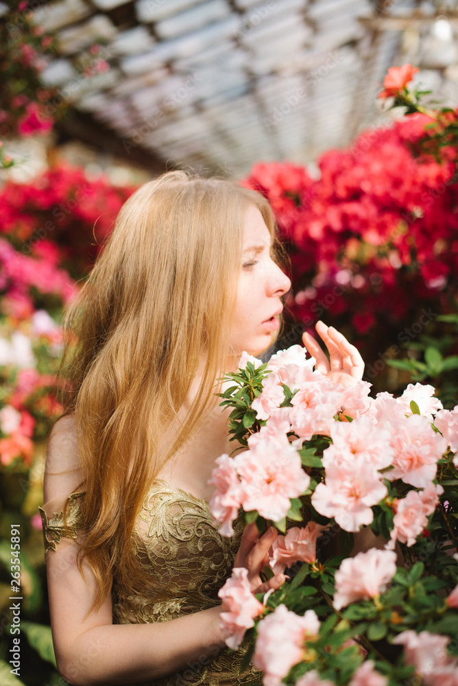 Woman in dress in flower gardens Woman in dress in flower gardens
