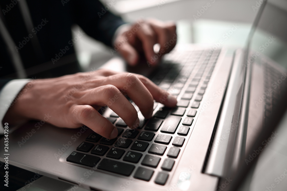 close up. businessman typing on laptop keyboard. close up. businessman typing on laptop keyboard.