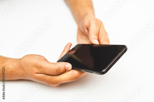 top view of hands holding a mobile phone