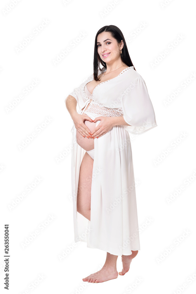 Young pregnant woman posing on white background Young pregnant woman posing on white background