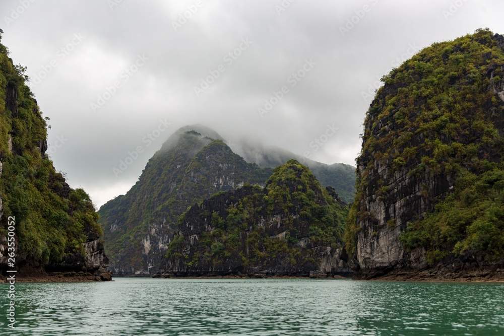 island mountain tops of ha long bay in Vietnam in clouds