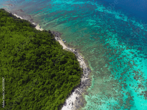 Aerial view of the beach on an island in the blue ocean