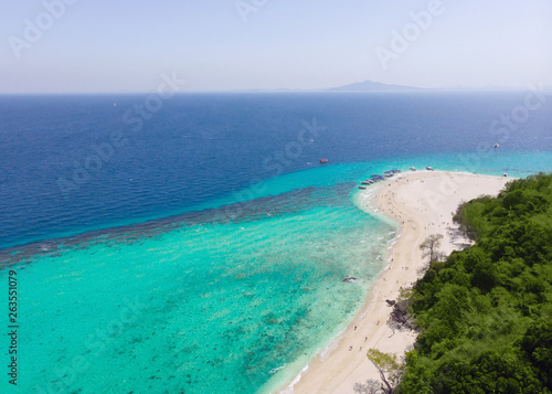 Aerial view of the beach on an island in the blue ocean © fotoplaton