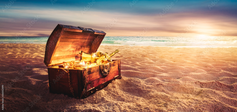 treasure chest at the beach by sunset - obrazy, fototapety, plakaty 